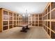 Large wine cellar with custom wood shelving and ample storage at 800 N Tamiami Trl # 405, Sarasota, FL 34236