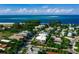 An aerial shot of a beachfront neighborhood, with a glimpse of a modern white building at 804 N Shore Dr, Anna Maria, FL 34216