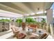 A well-lit balcony with stylish seating, ideal for relaxation and outdoor entertainment at 804 N Shore Dr, Anna Maria, FL 34216