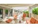 An inviting covered patio with stylish outdoor seating, perfect for enjoying the outdoors at 804 N Shore Dr, Anna Maria, FL 34216