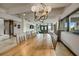 A long wood table defines the dining space in this open floor plan living space at 804 N Shore Dr, Anna Maria, FL 34216