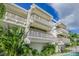 Striking architectural design of this multi-story building features private balconies on each level at 804 N Shore Dr, Anna Maria, FL 34216