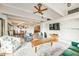This open living space features wood beams, recessed lighting, and a kitchen view at 804 N Shore Dr, Anna Maria, FL 34216