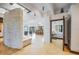 Open floor plan featuring a stone accent wall and an open doorway to the main bedroom at 804 N Shore Dr, Anna Maria, FL 34216