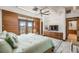 The main bedroom features wood wall paneling, wood floors and a view to the exterior at 804 N Shore Dr, Anna Maria, FL 34216