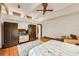 Spacious main bedroom with hardwood floors, area rug, closet, and balcony at 804 N Shore Dr, Anna Maria, FL 34216