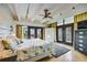 Spacious main bedroom with tile floors, modern ceiling fan, and access to the outside at 804 N Shore Dr, Anna Maria, FL 34216