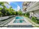 Refreshing backyard pool and spa with an outdoor grill, ideal for entertaining at 804 N Shore Dr, Anna Maria, FL 34216