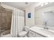 Bathroom featuring a shower/tub combination with tile surround and single sink vanity with solid surface countertops at 850 Tidewater Shores Loop # 102, Bradenton, FL 34208