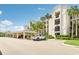 Apartment building with parking and tropical foliage at 850 Tidewater Shores Loop # 102, Bradenton, FL 34208