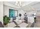 Dining area next to the kitchen, featuring a glass table with seating, and a modern, open design at 850 Tidewater Shores Loop # 102, Bradenton, FL 34208