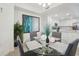 Dining area next to kitchen, featuring a glass table with seating, and a modern, open design at 850 Tidewater Shores Loop # 102, Bradenton, FL 34208