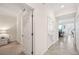 Bright hallway with white doors leading to different rooms, showcasing modern design at 850 Tidewater Shores Loop # 102, Bradenton, FL 34208