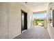 Common area with an elevator, walkway, and covered parking at 850 Tidewater Shores Loop # 102, Bradenton, FL 34208