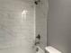 Bright bathroom featuring a tiled tub/shower with chrome fixtures and white subway tile at 8706 Arrow Creek Dr, Parrish, FL 34219