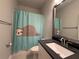 Bathroom with a quirky sloth shower curtain, modern vanity, and sleek faucet at 8706 Arrow Creek Dr, Parrish, FL 34219