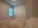 Neutral bedroom with carpet and natural light from a window with blinds at 8706 Arrow Creek Dr, Parrish, FL 34219