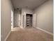 Carpeted bedroom with spacious closet and neutral paint, ready for personalization at 8706 Arrow Creek Dr, Parrish, FL 34219