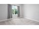 Cozy bedroom with neutral carpet, a window with curtains, and natural light at 8706 Arrow Creek Dr, Parrish, FL 34219