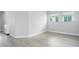A pristine bedroom with neutral walls and wood-look floors offers a versatile living space at 8706 Arrow Creek Dr, Parrish, FL 34219