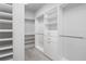 Walk-in closet with built-in shelving and storage space at 8706 Arrow Creek Dr, Parrish, FL 34219