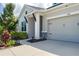 A well-maintained home featuring a two-car garage, neutral paint, and neatly landscaped front yard at 8706 Arrow Creek Dr, Parrish, FL 34219