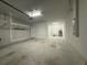 Spacious garage featuring clean concrete floors and ample storage options at 8706 Arrow Creek Dr, Parrish, FL 34219