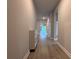 Inviting hallway featuring stylish flooring and neutral wall colors at 8706 Arrow Creek Dr, Parrish, FL 34219