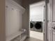 Convenient laundry room with modern washer, dryer, and ample storage space at 8706 Arrow Creek Dr, Parrish, FL 34219