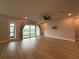 Expansive living room with sliding glass doors offering views of the backyard and water at 8706 Arrow Creek Dr, Parrish, FL 34219
