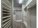 Spacious walk-in closet with ample shelving, hanging rods, and custom organization system at 8706 Arrow Creek Dr, Parrish, FL 34219