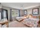 Bedroom with twin beds, a large window, neutral walls, and carpeted floors at 8717 Misty Creek Dr, Sarasota, FL 34241