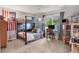 Bedroom with a bunk bed, desk, and a window with green views of trees and bushes at 8717 Misty Creek Dr, Sarasota, FL 34241