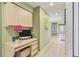 Hallway with desk and storage area, neutral paint and tile, with views to other rooms at 8717 Misty Creek Dr, Sarasota, FL 34241
