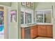 Updated kitchen features granite countertops and stainless steel appliances overlooking the pool at 8717 Misty Creek Dr, Sarasota, FL 34241