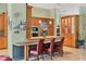 Stylish kitchen with updated appliances, a breakfast bar, and ample cabinet space at 8717 Misty Creek Dr, Sarasota, FL 34241