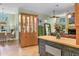 Open concept kitchen and dining area with custom cabinetry, stainless steel appliances, and plenty of counter space at 8717 Misty Creek Dr, Sarasota, FL 34241