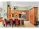 Well-equipped kitchen with custom cabinetry, stainless steel appliances, and a breakfast bar at 8717 Misty Creek Dr, Sarasota, FL 34241