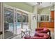 Bright living space with views of screened-in patio and pool at 8717 Misty Creek Dr, Sarasota, FL 34241