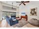 Bright living room with views of screened-in patio and pool at 8717 Misty Creek Dr, Sarasota, FL 34241