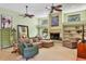 Living room with fireplace, built-in shelves, and plush seating at 8717 Misty Creek Dr, Sarasota, FL 34241