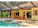 Inviting pool and patio area, perfect for outdoor relaxation and entertaining guests at 8717 Misty Creek Dr, Sarasota, FL 34241