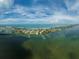 Gorgeous aerial view of community, intercoastal waterway, beach, and Gulf of Mexico at 8750 Midnight Pass Rd # 501, Sarasota, FL 34242