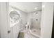 Bathroom with shower, vanity, stone floors and unique wall covering at 8750 Midnight Pass Rd # 501, Sarasota, FL 34242