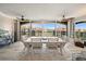 Elegant dining room with a modern table setting, scenic views, and stylish decor, creating a comfortable atmosphere at 8750 Midnight Pass Rd # 501, Sarasota, FL 34242