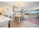 Bright open floor plan, with hardwood flooring, a dining area, and natural light at 8750 Midnight Pass Rd # 501, Sarasota, FL 34242