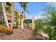 Tortuga sign with palm trees and building exterior in the background at 8750 Midnight Pass Rd # 501, Sarasota, FL 34242