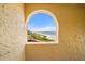 Beach view through arched opening at 8750 Midnight Pass Rd # 501, Sarasota, FL 34242