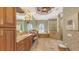 Spacious primary bathroom featuring dual vanities, garden tub, and separate glass enclosed shower at 8832 Enclave Ct, Sarasota, FL 34238