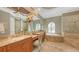 Primary bathroom offers dual sinks, make up vanity, garden tub, and separate glass enclosed shower at 8832 Enclave Ct, Sarasota, FL 34238
